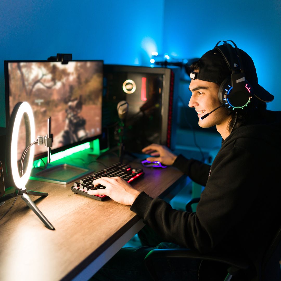 a young man gaming on a pc