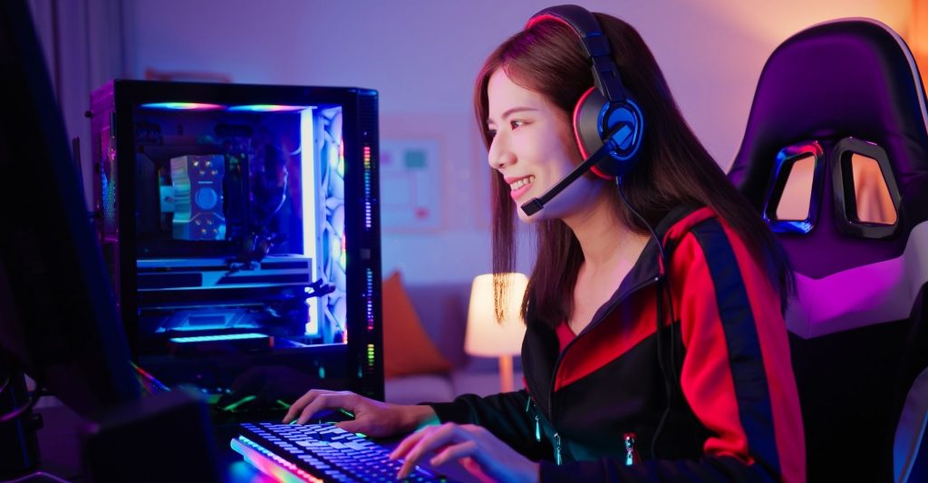 young woman using gaming PC